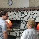 Tony in front of pizza oven in Italy